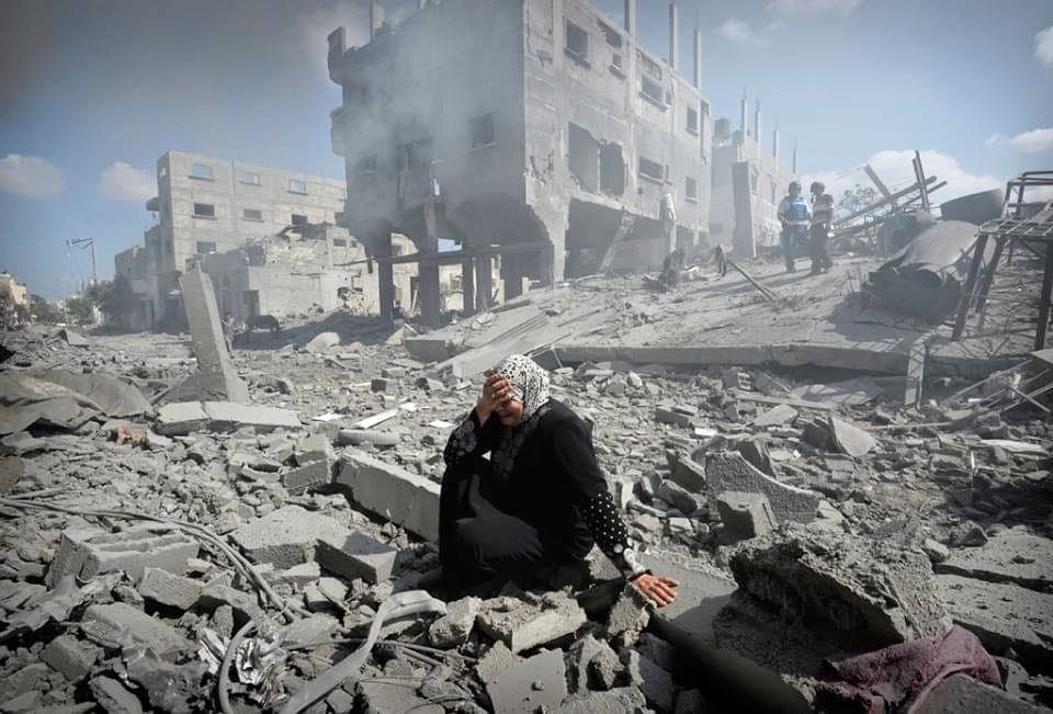 gaza woman in rubbleADJ